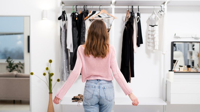 woman looking at closet 