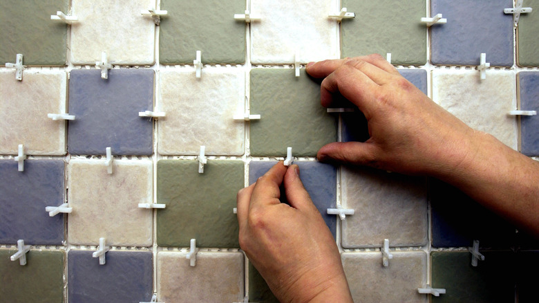 tile spacers being used