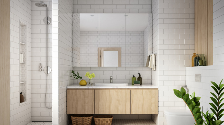 Bathroom with floor to ceiling rectangular tile.