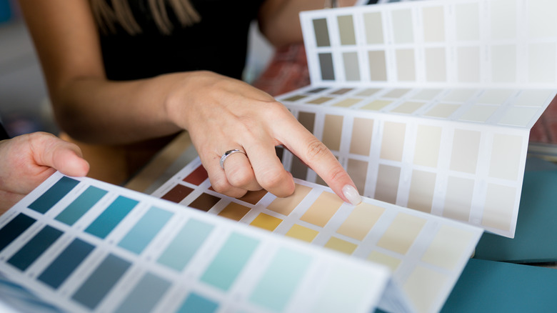 Couple looking at paint swatches