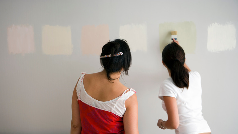 People looking at wall paint