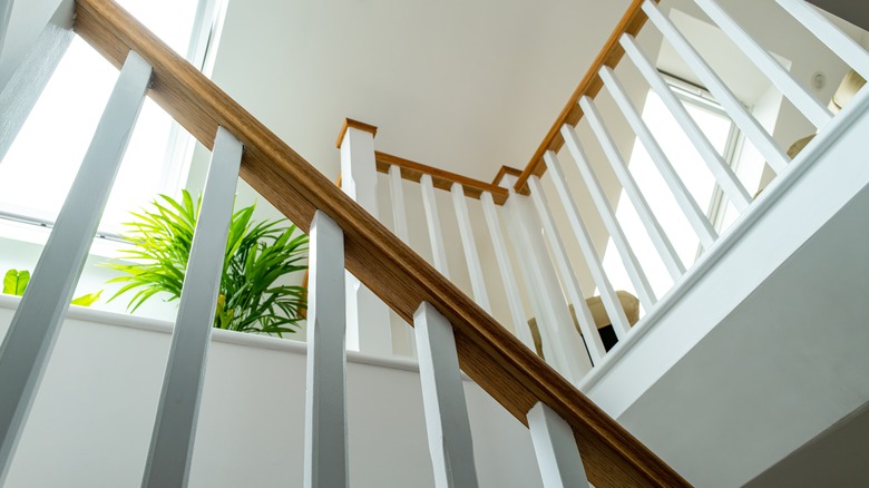 a white stair well ceiling