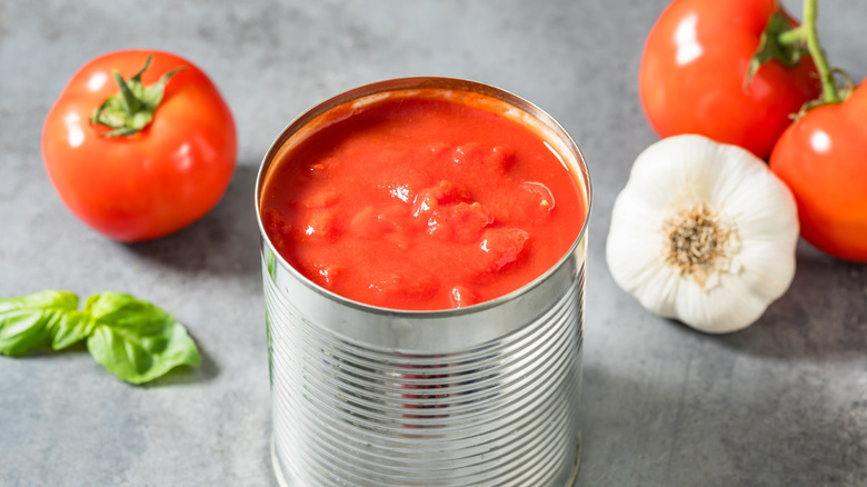 Organic raw diced canned tomatoes in a tin.