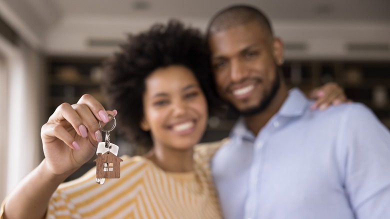 home buyers with keys