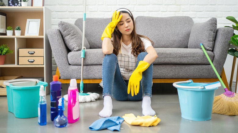 Woman stressed cleaning