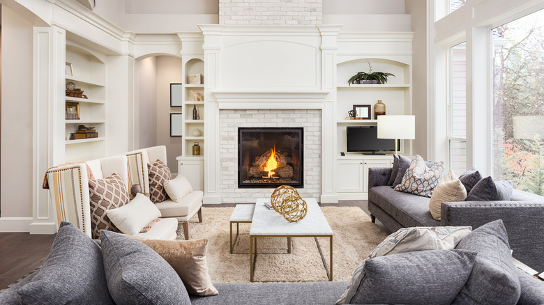 Modern fireplace and TV display in a white and gray living room