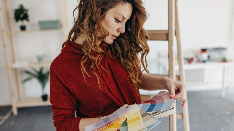 Woman selecting paint color