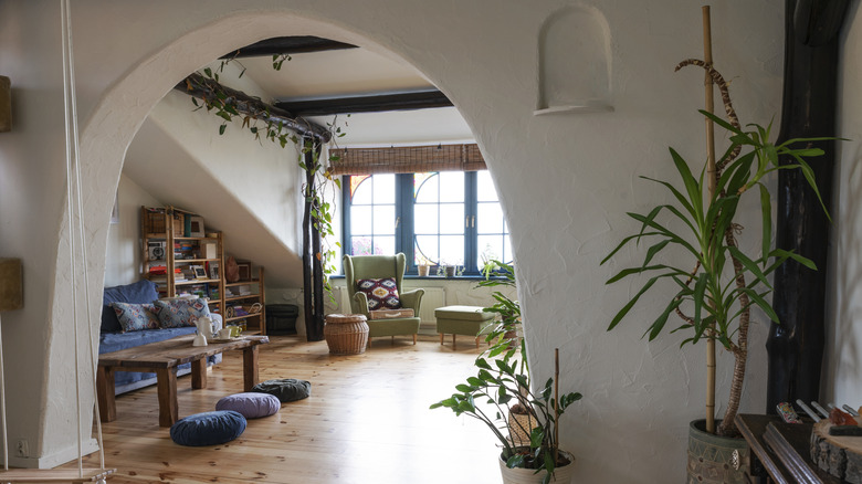 large archway into boho living room
