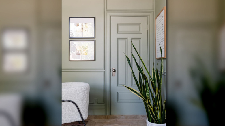 Evergreen fog paint color by Sherwin-Williams on an interior door and trim.