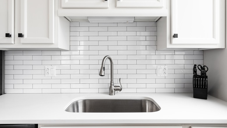 Kitchen with white subway tile