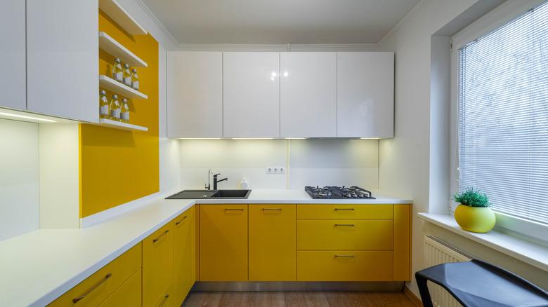 Modern Japandi mock up room interior design and decoration with green pastel counter and cabinet.