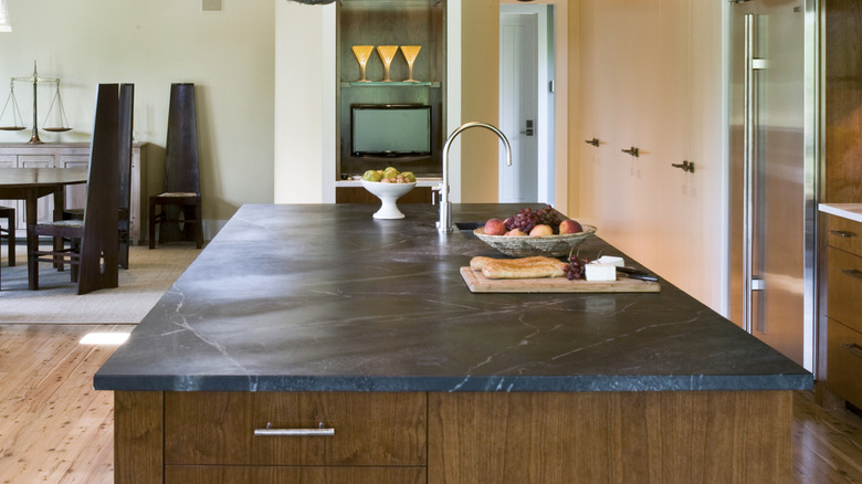 A large black marble kitchen island.