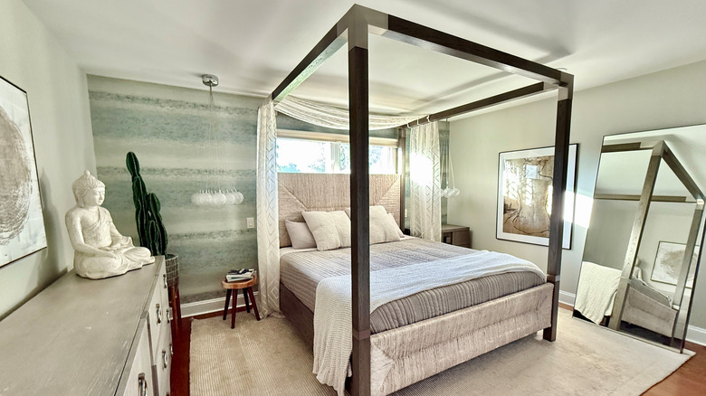 Modern canopy bed with sleek metal frame, headboard, and modern textures