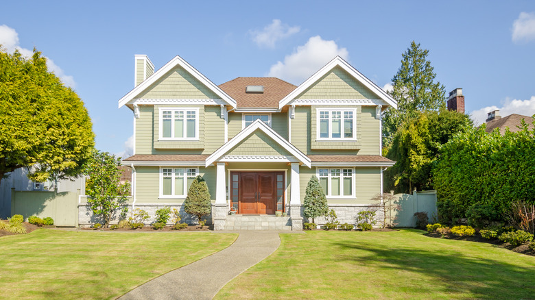 large house with manicured yard