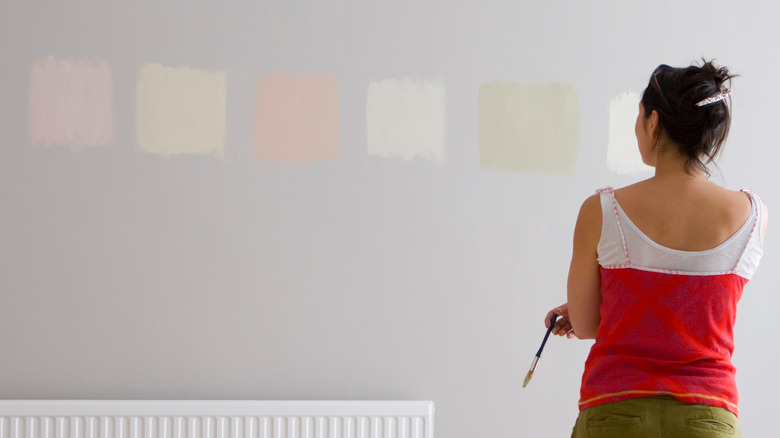 Woman looking at paint samples