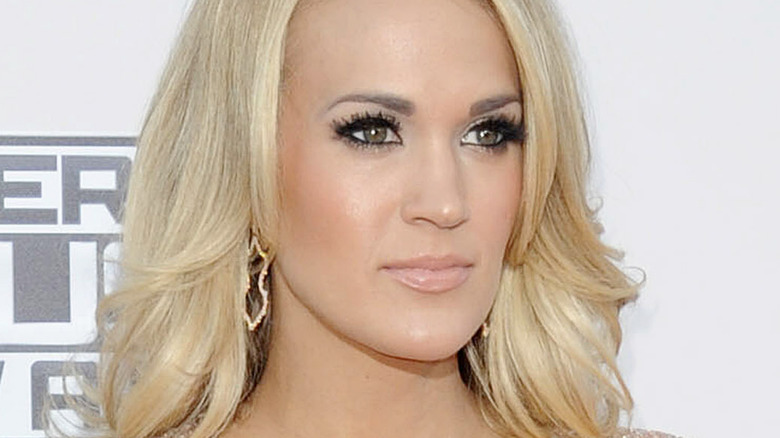 Carrie Underwood in gold dress