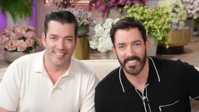 Drew and Jonathan Scott close-up photo the set of their show