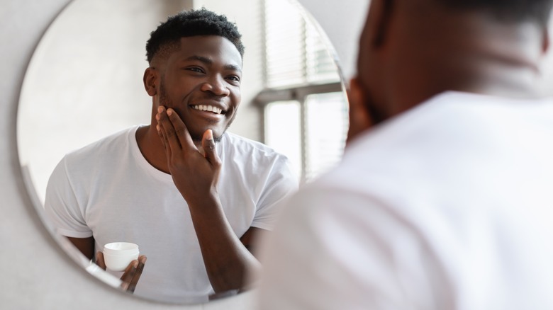 Person looking into mirror