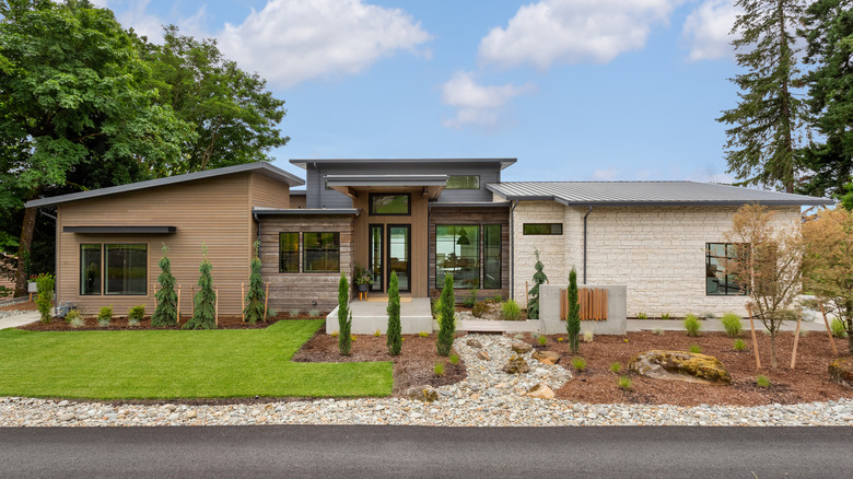 house exterior with wood and stone siding