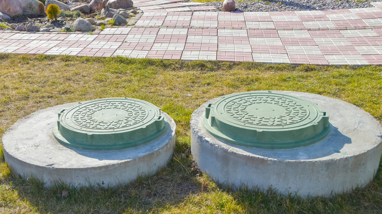Two septic tank covers
