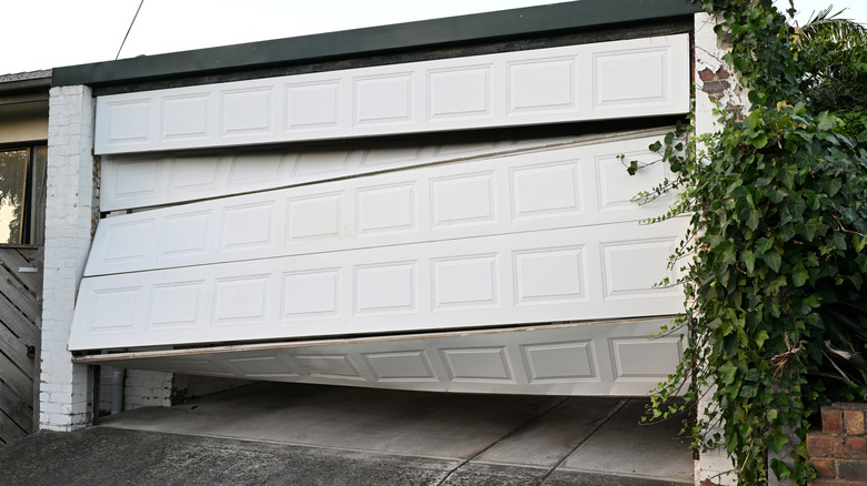 A bent and broken garage door
