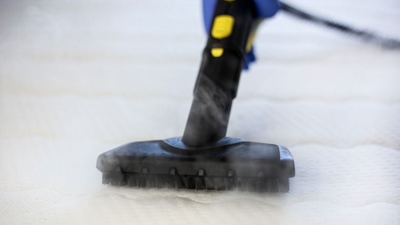 steam cleaner on mattress