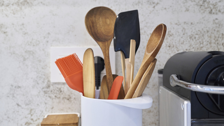 wooden spoons and kitchen tools on counter