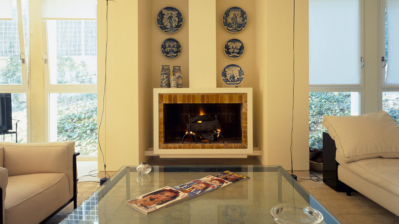 modern fireplace in yellow room