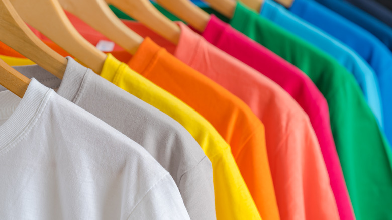 bright shirts on hangers