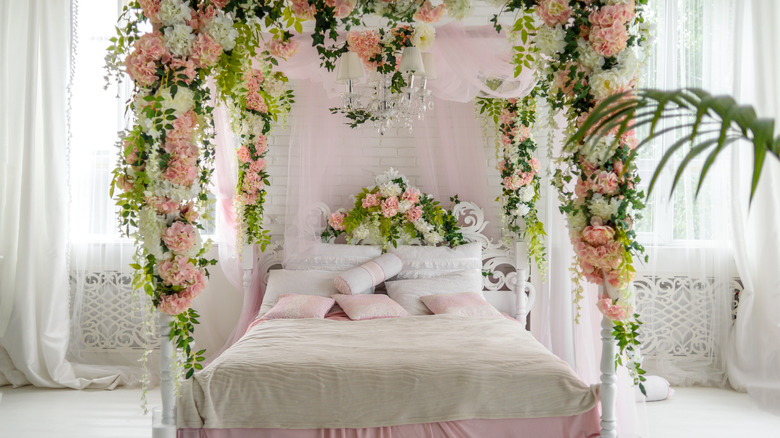 romantic bed with floral canopy