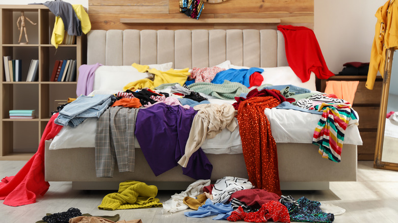 A pile of clothes on the bed