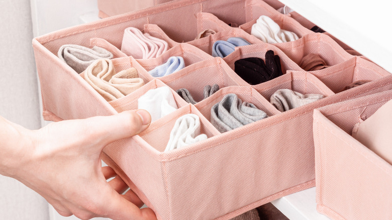 square folded socks in organizer