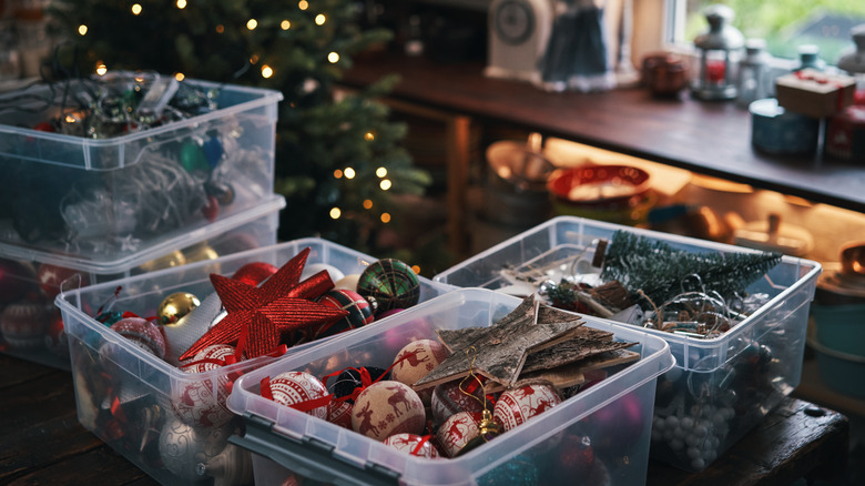 Clear bins of Christmas decorations