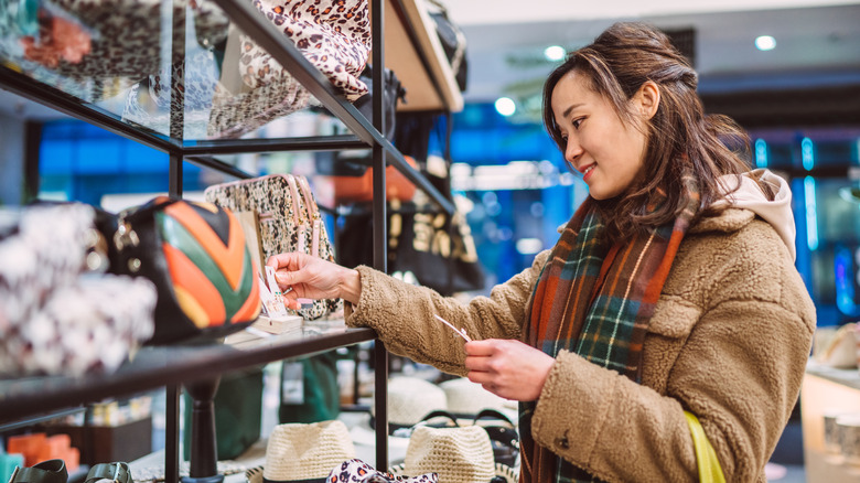 Woman shopping for purses