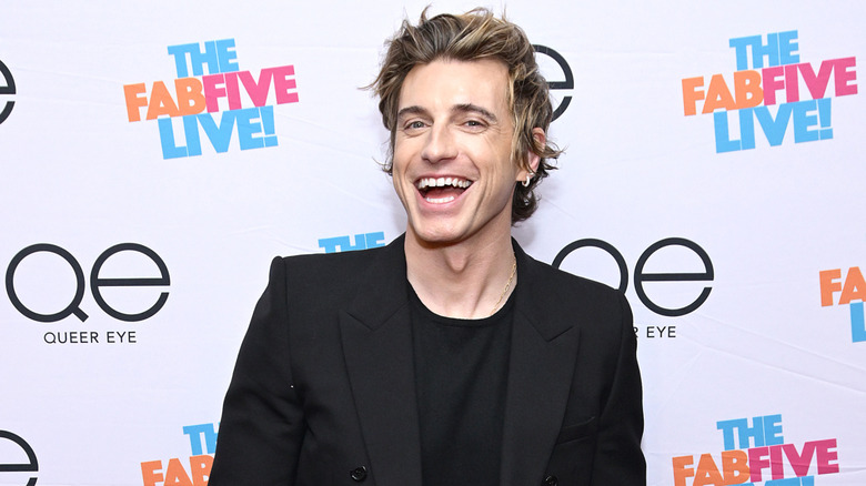 Jeremiah Brent smiling outside The Fab Five Live event