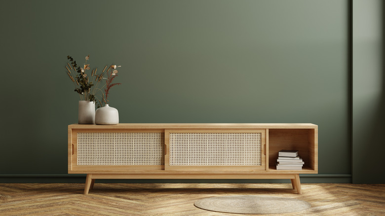 Sideboard with vases and books