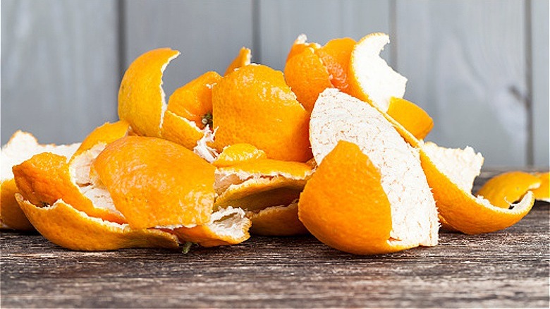 Orange peels on wood surface