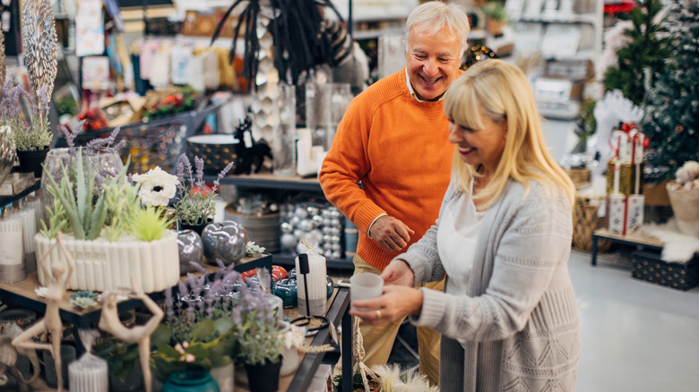 An older couple shopping for decor