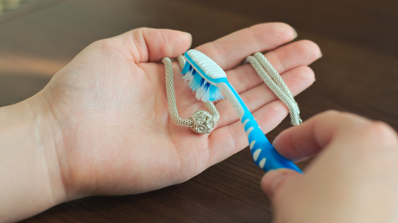 cleaning silver chain with toothbrush