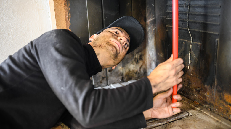 person cleaning chimney 