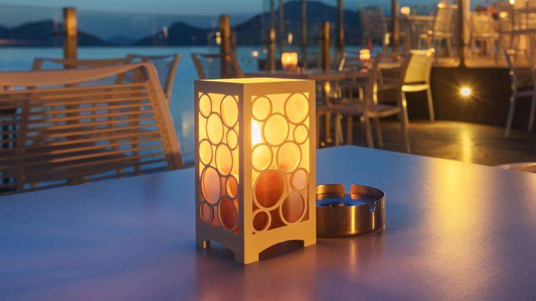 Outdoor rechargeable lamp on a patio table