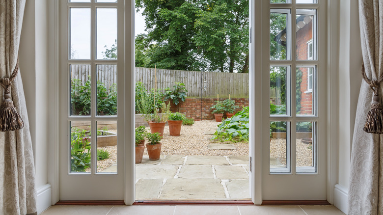 A patio leading outside to backyard