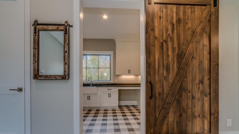 Country home with rustic checkered flooring in kitchen