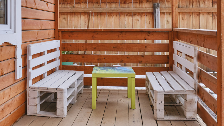 a cozy backyard retreat with furniture made from free pallet wood