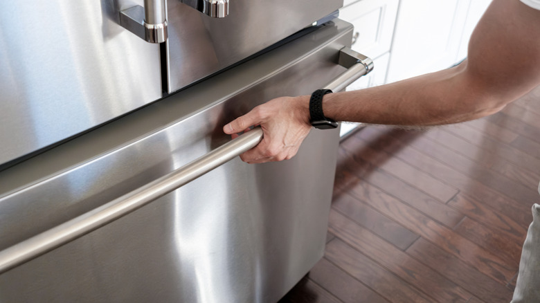 Man opening up freezer