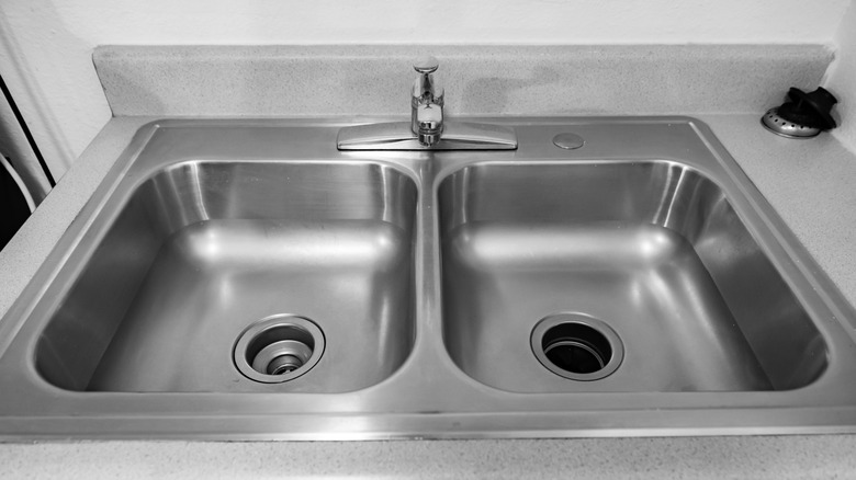 A clean stainless steel kitchen sink