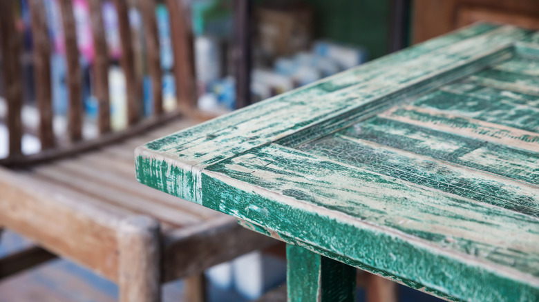 Faded wooden furniture due to sun exposure