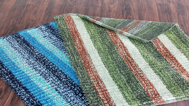 Colorful textured blue, green, and red bath mats