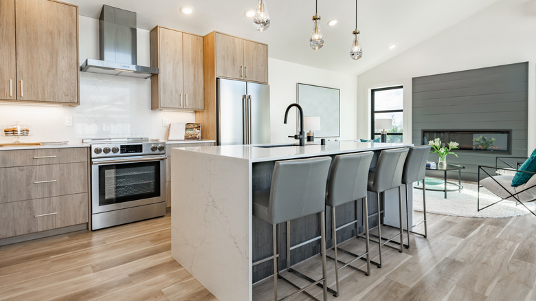 Modern kitchen with a glossy wood floor