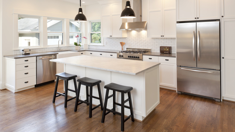 A white kitchen with island